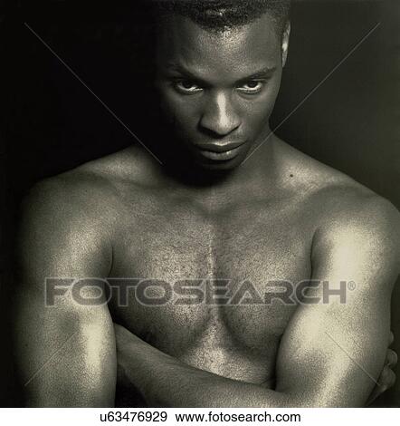Stock Photo - Close-up of a man with a parrot on his shoulder. Fotosearch