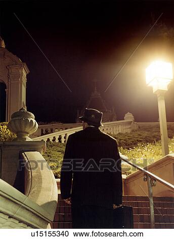 Stock Image - Close-up of a young man looking away. Fotosearch
