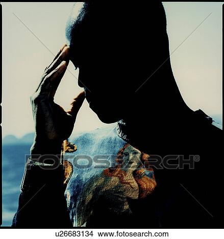 Picture - Shadow superimposed on a young man's chest. Fotosearch