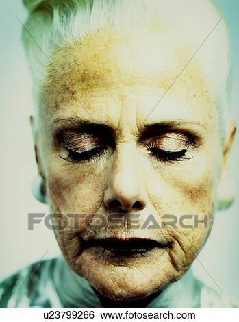 Side profile of a man holding an umbrella View Large Photo Image Stock Photograph - Side profile of a man holding an umbrella. Fotosearch