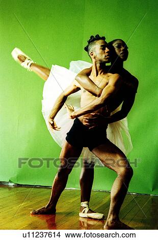 Female ballet dancer hugging a male ballet dance from back and raising her leg View Large Photo Image Picture - Female ballet dancer hugging a male ballet dance from back and raising her leg. Fotosearch