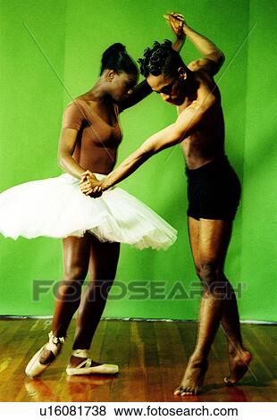 Male and female ballet dancers holding hands of each other and dancing View Large Photo Image Stock Photo - Male and female ballet dancers holding hands of each other and dancing. Fotosearch