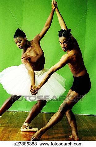 Male and female ballet dancers holding hands of each other and dancing View Large Photo Image Stock Photo - Male and female ballet dancers holding hands of each other and dancing. Fotosearch