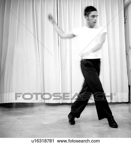 Male dancer practicing in a studio View Large Photo Image Stock Image - Male dancer practicing in a studio. Fotosearch