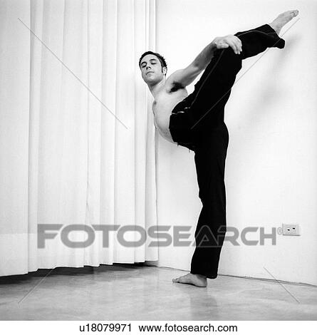 Male dancer practicing in a studio View Large Photo Image Stock Image - Male dancer practicing in a studio. Fotosearch