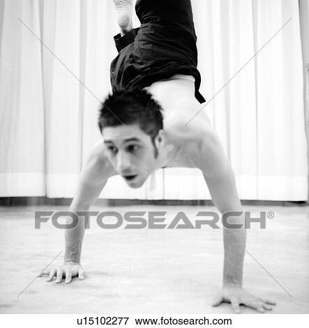 Male dancer practicing in a studio View Large Photo Image Stock Photo - Male dancer practicing in a studio. Fotosearch