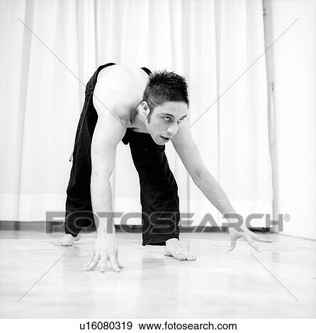 Male dancer practicing in a studio View Large Photo Image Stock Photo - Male dancer practicing in a studio. Fotosearch