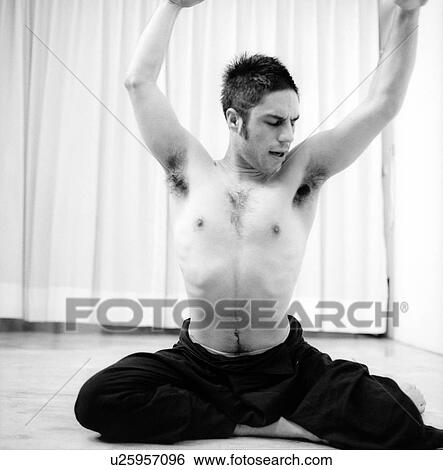 Male dancer practicing in a studio View Large Photo Image Stock Photograph - Male dancer practicing in a studio. Fotosearch