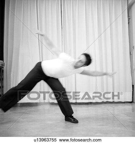 Male dancer practicing in a studio View Large Photo Image Stock Photography - Male dancer practicing in a studio. Fotosearch