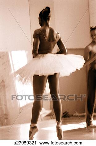 Two ballet dancers practicing in a studio View Large Photo Image Stock Image - Two ballet dancers practicing in a studio. Fotosearch