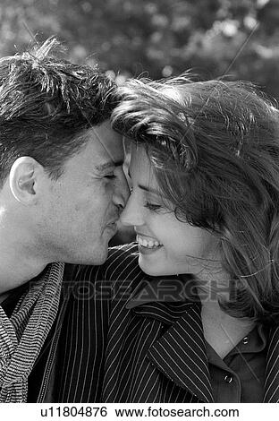 Stock Photograph - Close-up of a couple romancing. Fotosearch