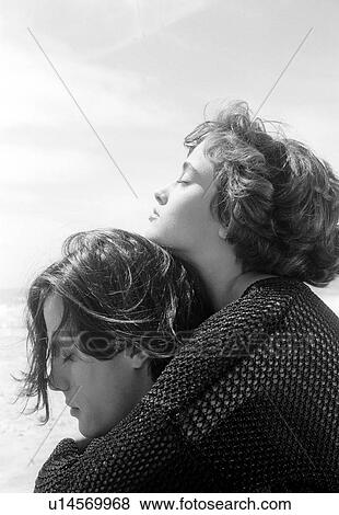 Woman embracing a man from back View Large Photo Image Stock Photo - Woman embracing a man from back. Fotosearch