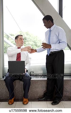 Business people having coffee break View Large Photo Image Stock Photo - Business people having coffee break. Fotosearch