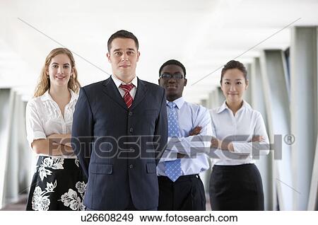 Business people standing together and looking at the camera View Large Photo Image Stock Photo - Business people standing together and looking at the camera. Fotosearch