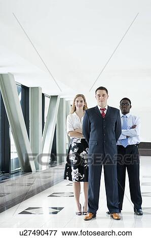 Business people standing together and looking at the camera View Large Photo Image Stock Photo - Business people standing together and looking at the camera. Fotosearch