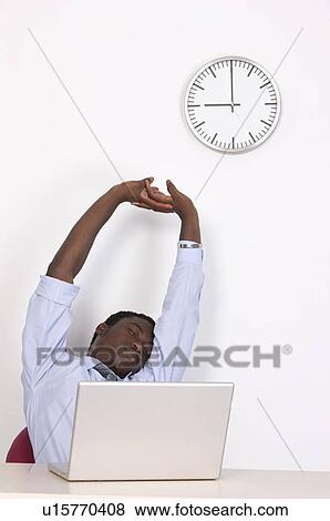 Stock Photo - Business people stretching and closing eyes at 9 o'clock. Fotosearch