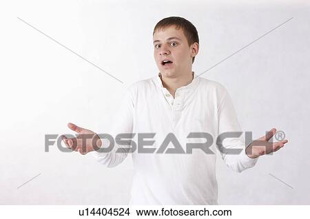 Young man shrugging View Large Photo Image Picture - Young man shrugging. Fotosearch