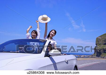 Four friends enjoying leisure activity of road trip together and smiling View Large Photo Image Stock Photo - Four friends enjoying leisure activity of road trip together and smiling. Fotosearch