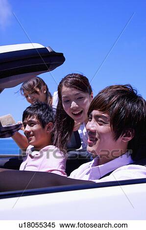 Four people driving for a road trip View Large Photo Image Stock Photography - Four people driving for a road trip. Fotosearch