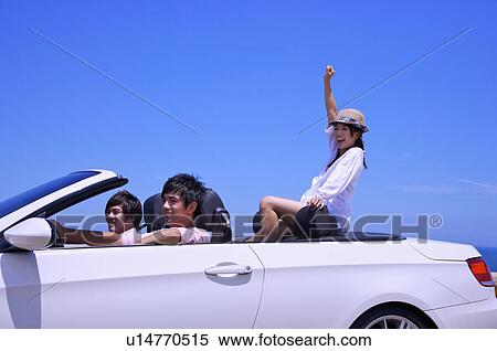 Three people driving in the car and enjoying leisure activity together View Large Photo Image Stock Photography - Three people driving in the car and enjoying leisure activity together. Fotosearch