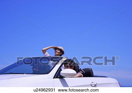 Three people sitting in the car and enjoying leisure activity together View Large Photo Image Stock Image - Three people sitting in the car and enjoying leisure activity together. Fotosearch