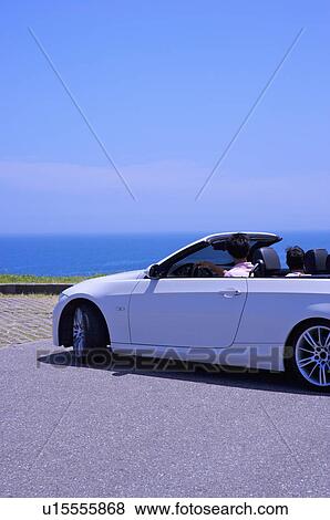 Two people driving in the car and looking away together View Large Photo Image Stock Photo - Two people driving in the car and looking away together. Fotosearch