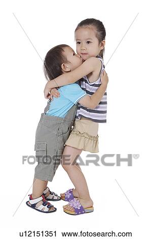 Little girl and little boy embracing together View Large Photo Image Stock Image - Little girl and little boy embracing together. Fotosearch