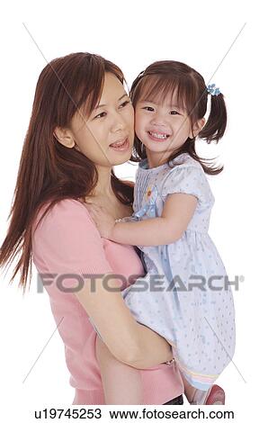 Young mother and daughter bonding together and smiling happily View Large Photo Image Stock Image - Young mother and daughter bonding together and smiling happily. Fotosearch