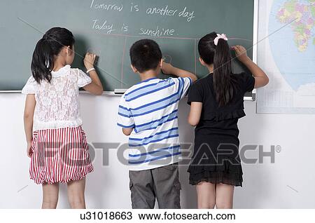 Child, Children standing in a row and writing on the blackboard together View Large Photo Image Stock Image - Child, Children standing in a row and writing on the blackboard together. Fotosearch