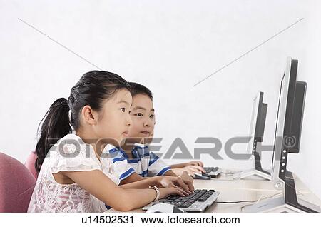 Child, Children using computer and learning together View Large Photo Image Stock Image - Child, Children using computer and learning together. Fotosearch
