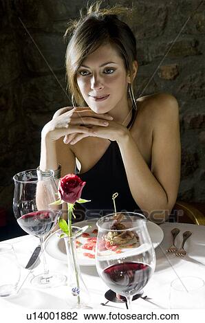 Young woman with plate of food and wine at restaurant View Large Photo Image Stock Image - Young woman with plate of food and wine at restaurant. Fotosearch