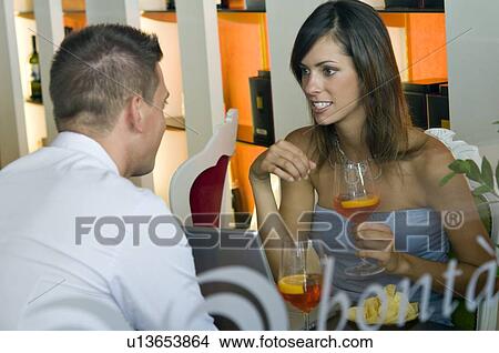 Couple sitting at laptop View Large Photo Image Picture - Couple sitting at laptop. Fotosearch