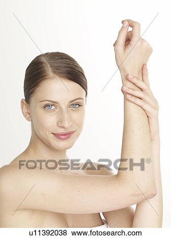 Stock Photo - Woman lifting her arm. Fotosearch