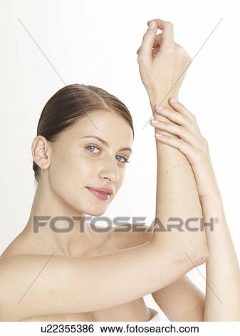 Woman lifting her arm View Large Photo Image Stock Photograph - Woman lifting her arm. Fotosearch