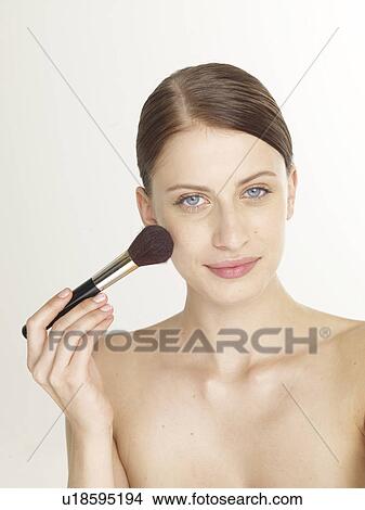 Picture - Woman with a face brush. Fotosearch