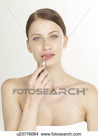 Picture - Woman with a lipstick. Fotosearch