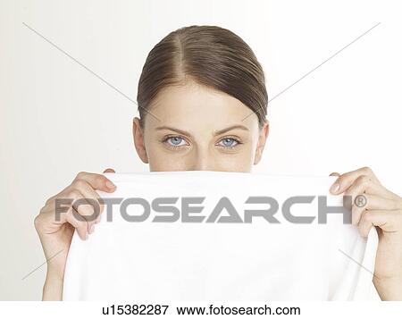 Woman with a white cloth View Large Photo Image Stock Photo - Woman with a white cloth. Fotosearch