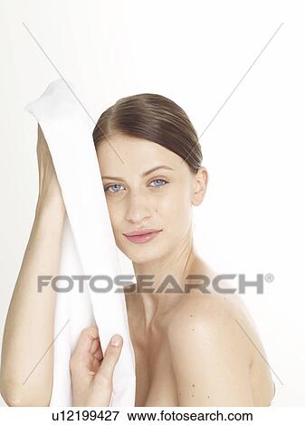 Woman with a white sheet View Large Photo Image Stock Photo - Woman with a white sheet. Fotosearch