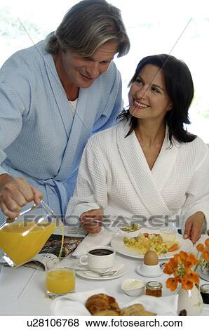 Stock Photo - Couple is having breakfast. Fotosearch
