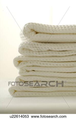 Stack of white piqué towels View Large Photo Image Stock Image - Stack of white piqué towels. Fotosearch