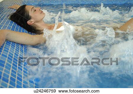 Woman in a whirlpool View Large Photo Image Stock Photo - Woman in a whirlpool. Fotosearch