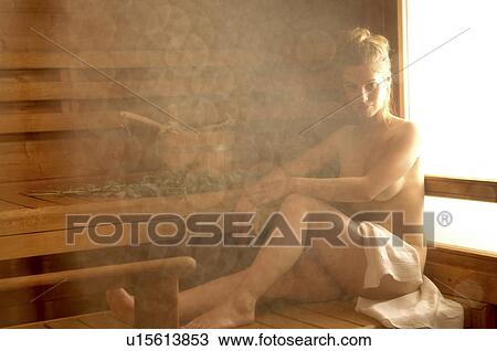 Stock Image - Woman in the sauna. Fotosearch