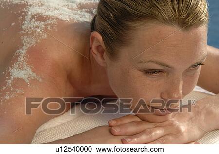 Woman lying on the massagebed View Large Photo Image Stock Image - Woman lying on the massagebed. Fotosearch