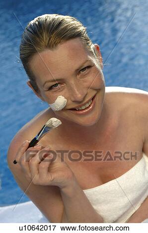 Woman with a facial mask and a brush View Large Photo Image Stock Photo - Woman with a facial mask and a brush. Fotosearch