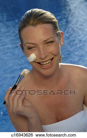 Woman with a facial mask and a brush View Large Photo Image Stock Photograph - Woman with a facial mask and a brush. Fotosearch