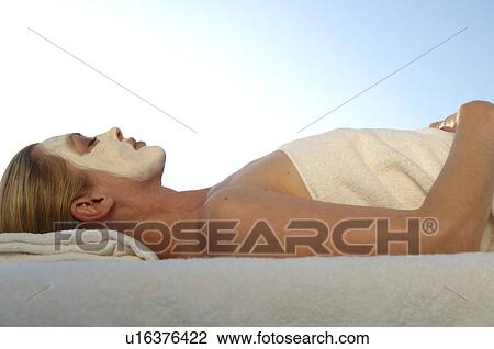 Woman with a facial mask View Large Photo Image Stock Image - Woman with a facial mask. Fotosearch