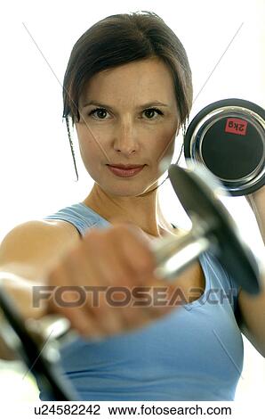 Woman with barbells View Large Photo Image Stock Image - Woman with barbells. Fotosearch