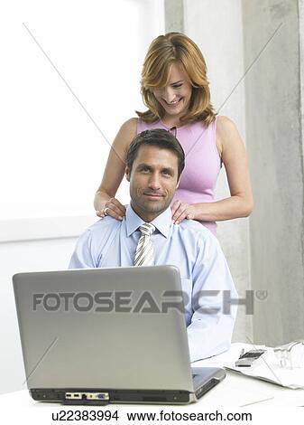 Business man gets a massage View Large Photo Image Picture - Business man gets a massage. Fotosearch