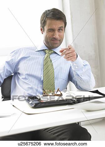 Business man is pointing with his finger View Large Photo Image Stock Photograph - Business man is pointing with his finger. Fotosearch