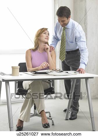 Business woman and man at the desk View Large Photo Image Stock Photo - Business woman and man at the desk. Fotosearch